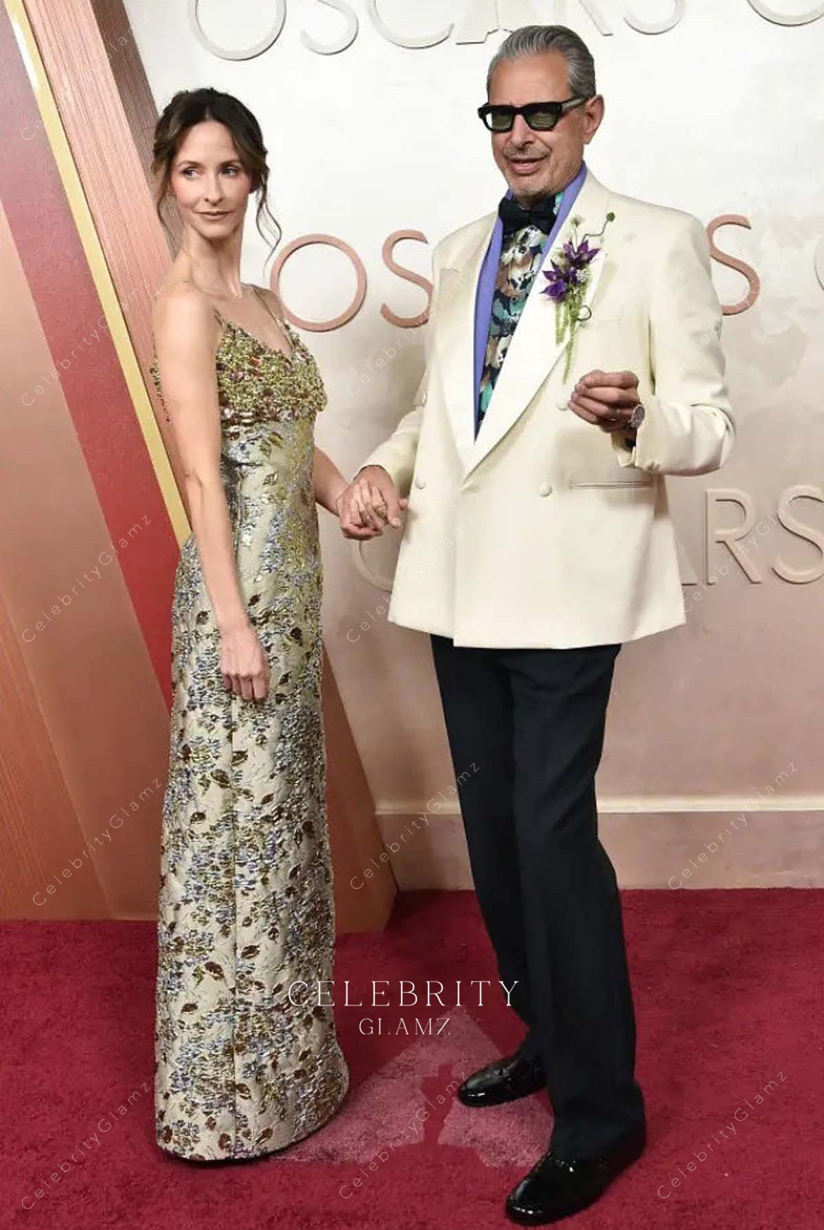 2025 Oscars red carpet Emilie Livingston taupe sleeveless dress