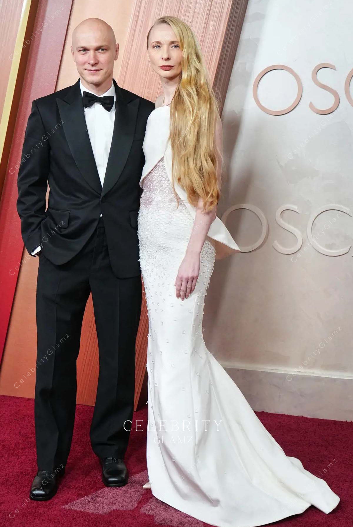 Anna Shevchuk white 2025 court train Oscars red carpet dress