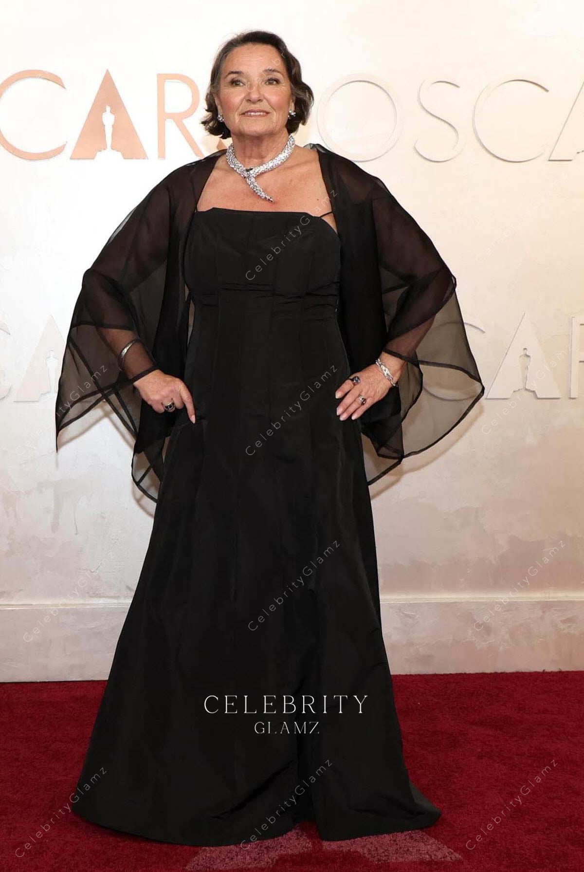 black Suzanne Stokes-Munton 2025 Oscars red carpet with shawl dress