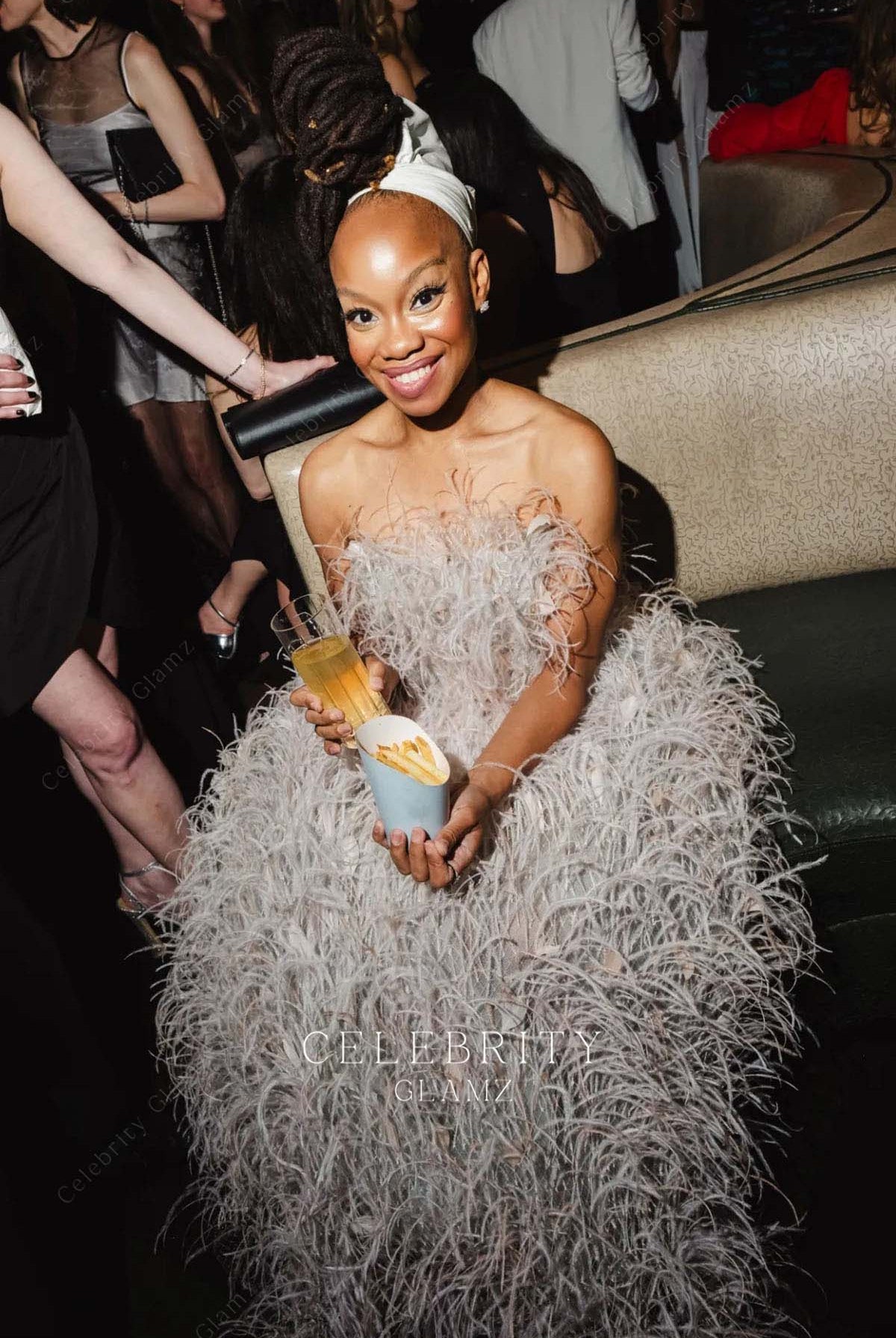 Camille A. Brown feathered strapless formal dress