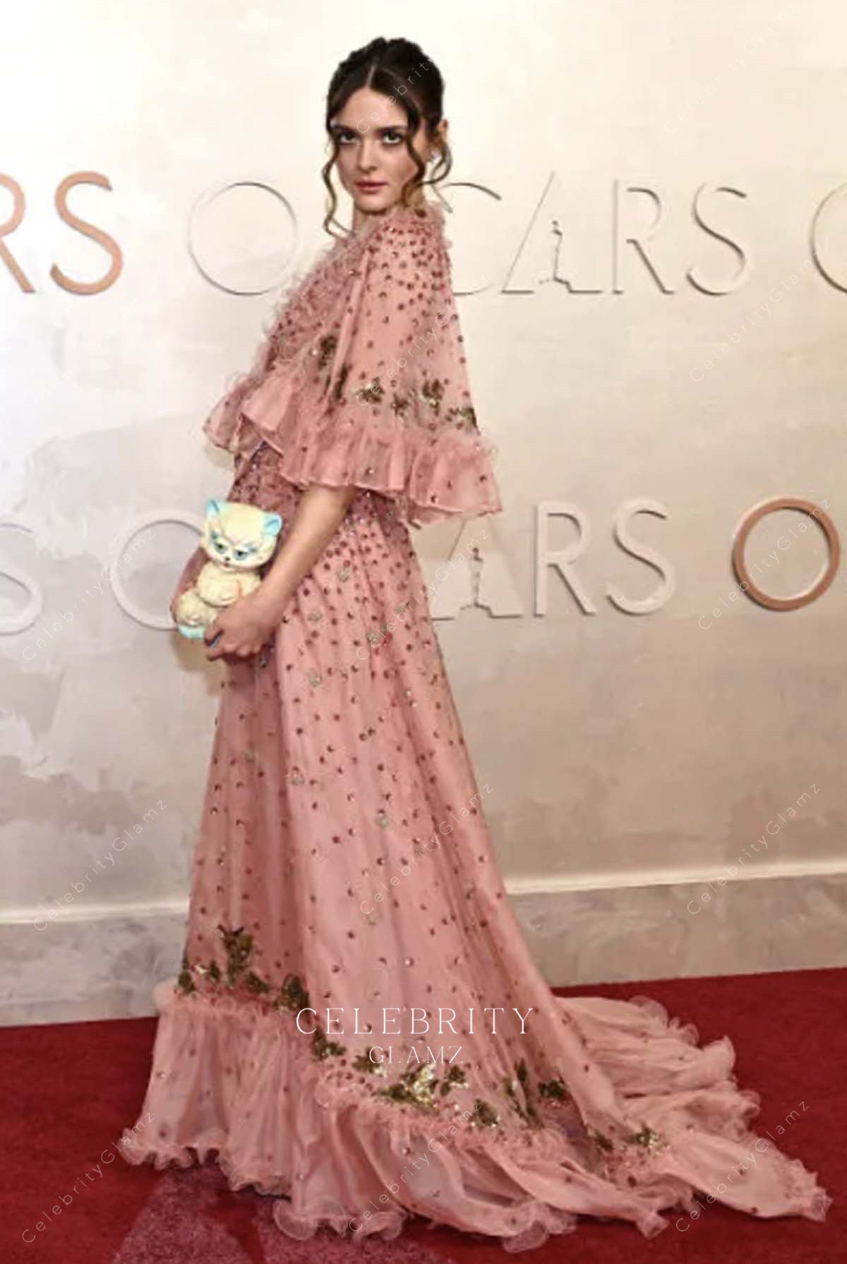 Charlotte Lawrence 2025 Oscars red carpet flutter sleeves prom dress