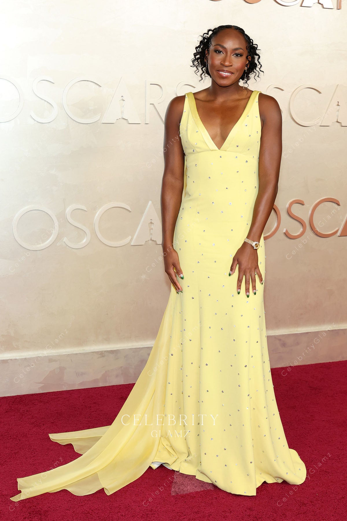 Coco Gauff 2025 Oscars red carpet fit flare dress