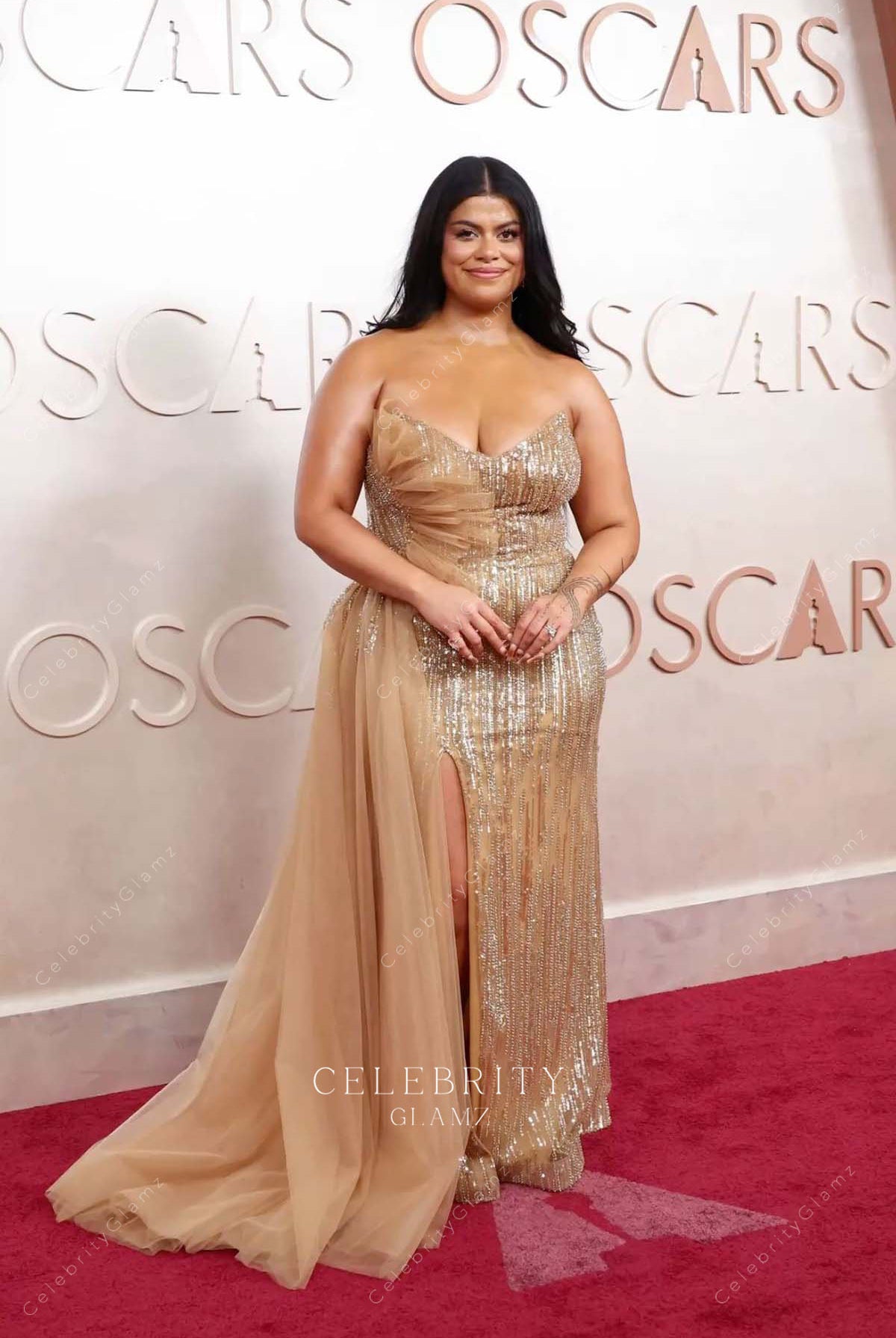 Drew Afualo 2025 Oscars red carpet flowing train dress