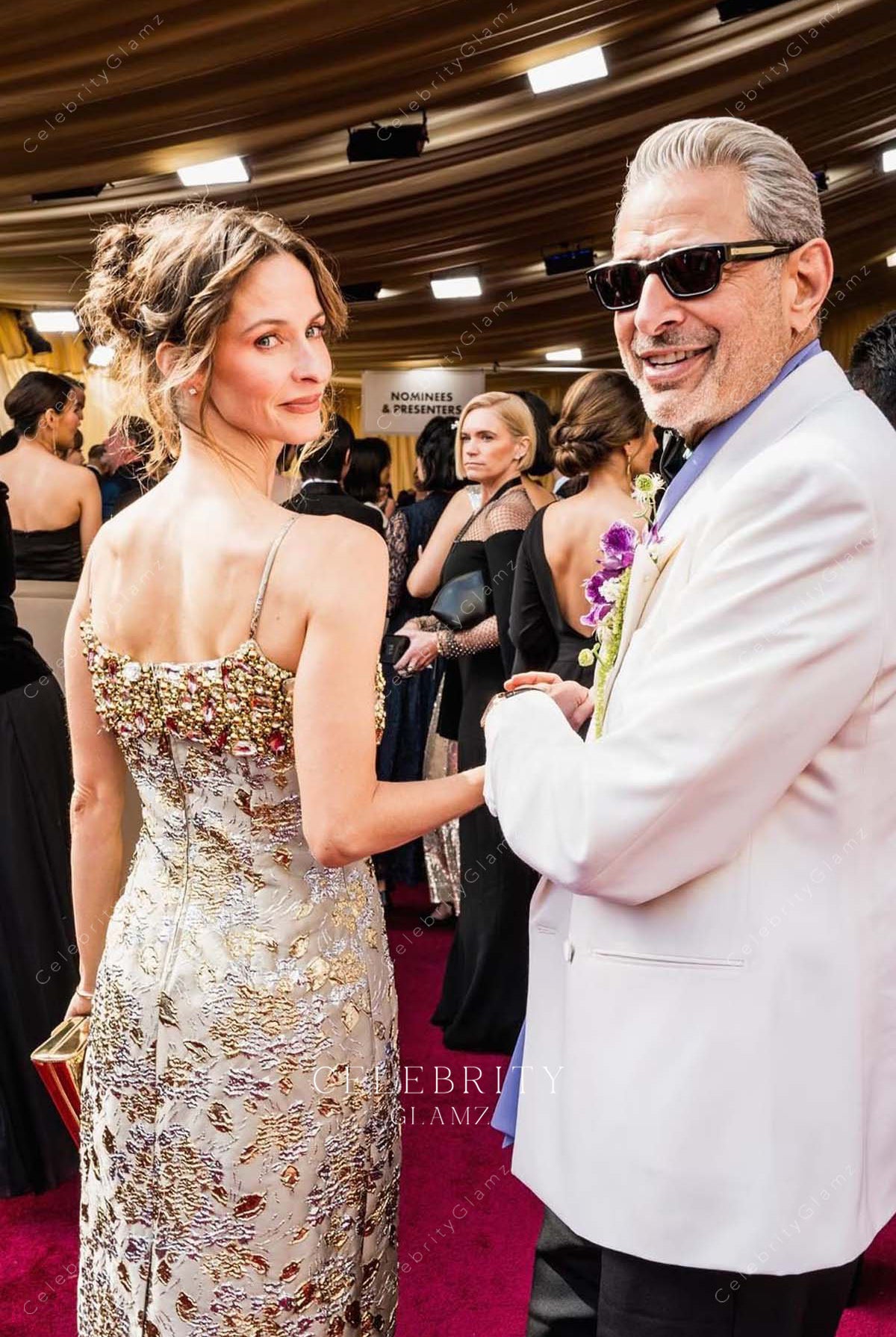 Emilie Livingston 2025 Oscars red carpet open back dress