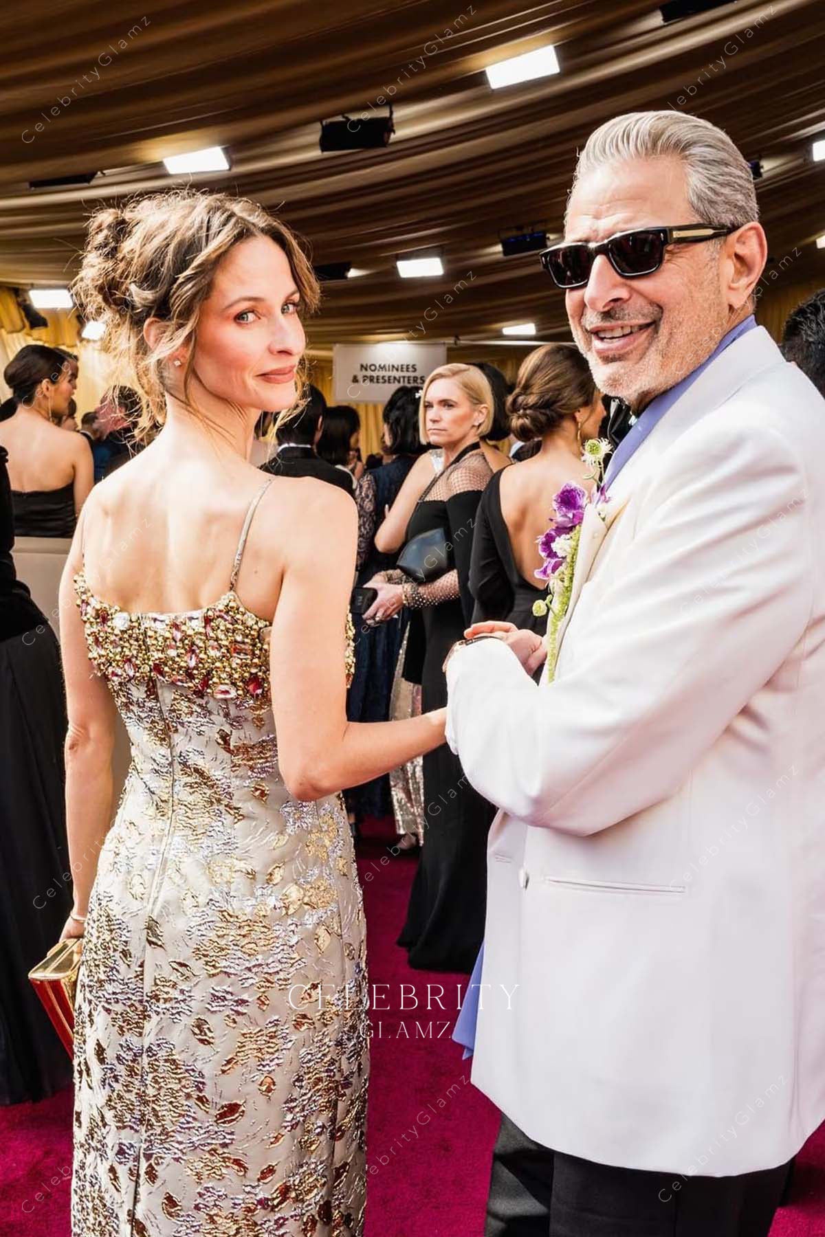 Emilie Livingston 2025 Oscars red carpet open back dress