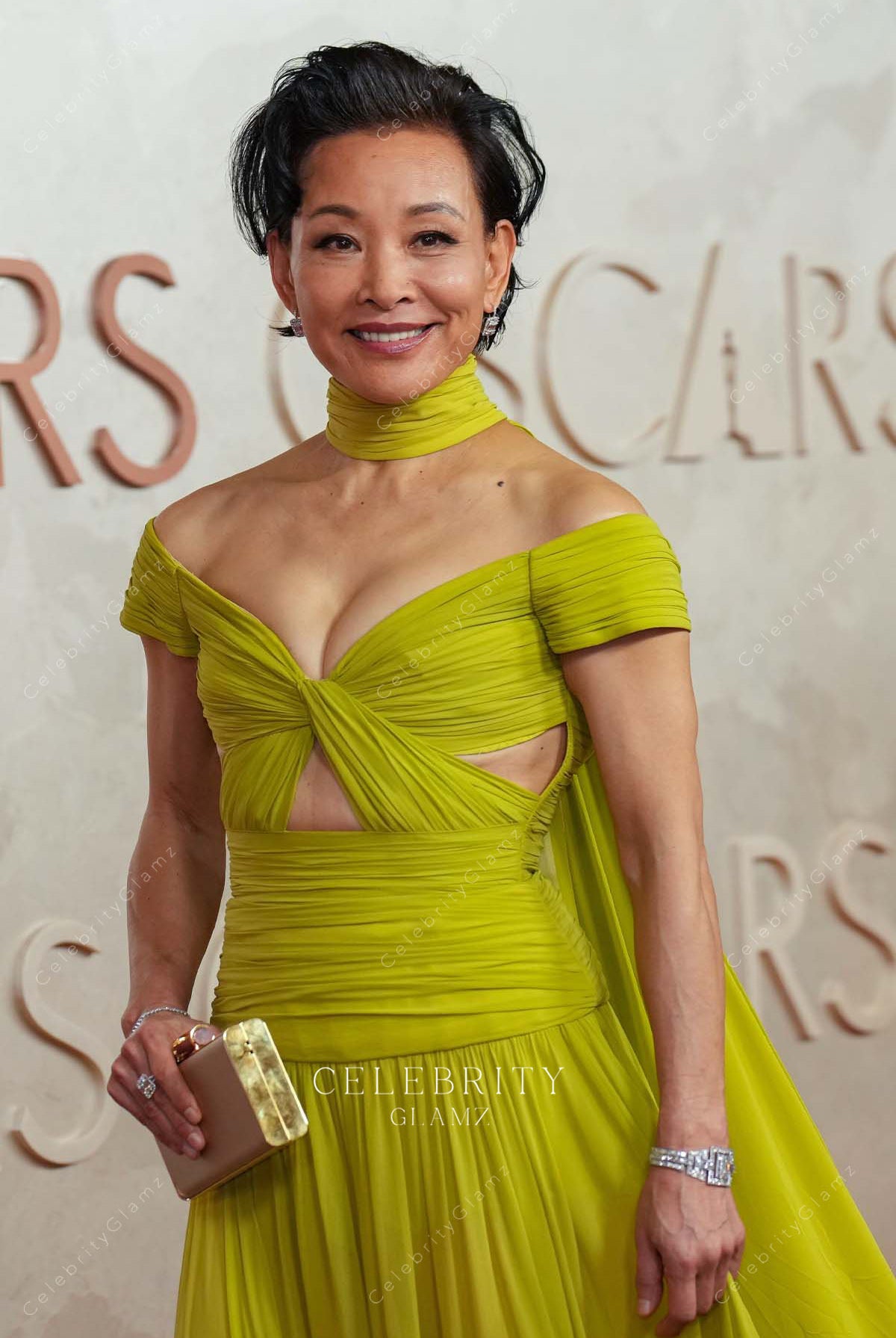 Joan Chen green 2025 Oscars red carpet off shoulder prom dress