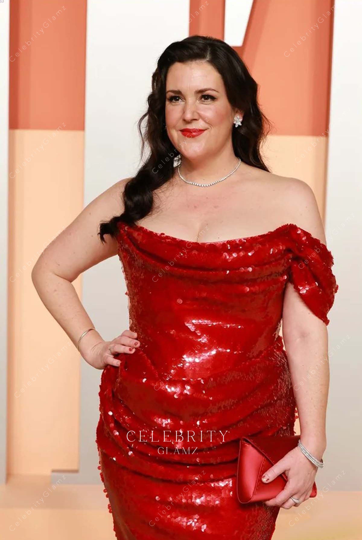 Melanie Lynskey red 2025 cowl neck Vanity fair party dress