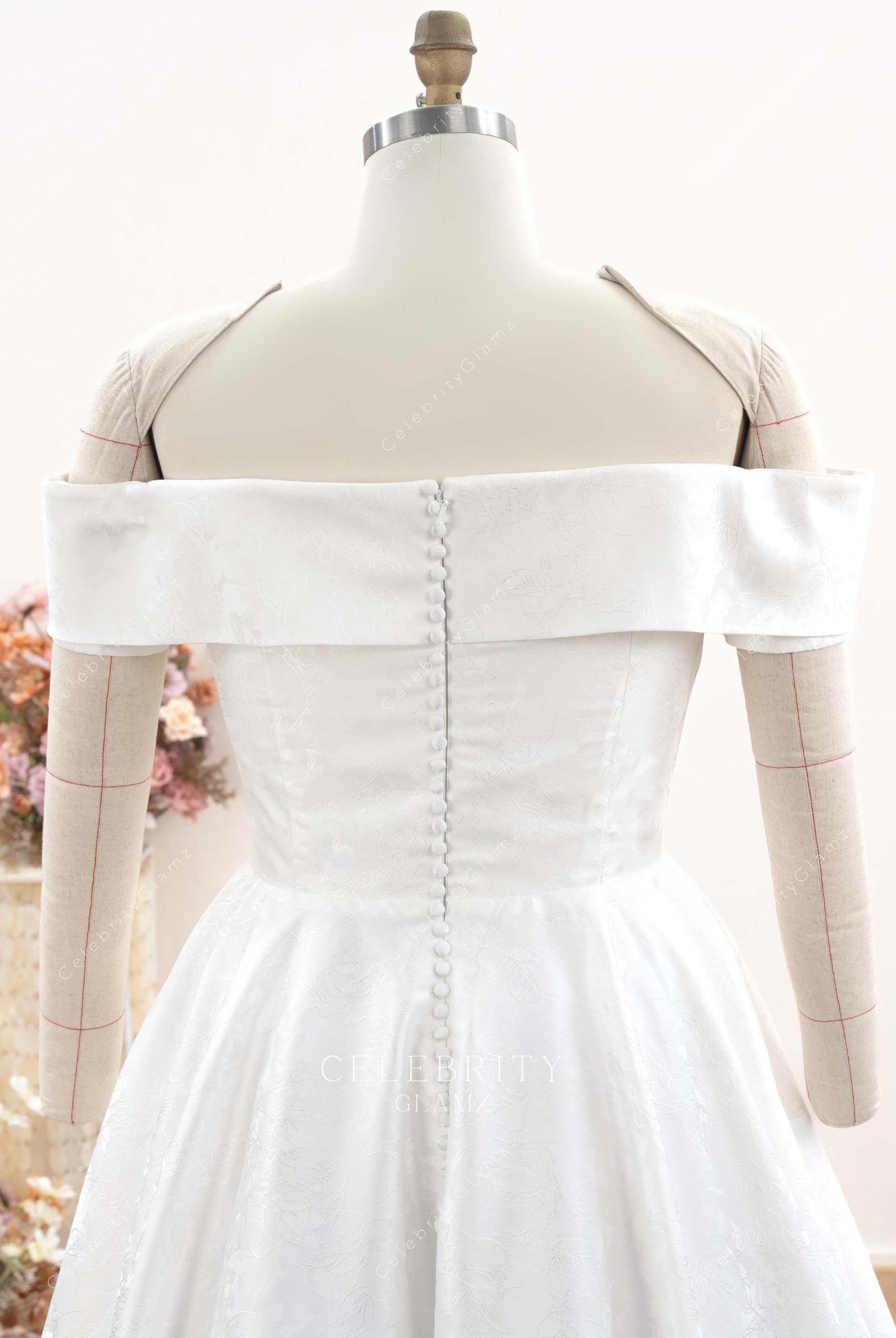 off shoulder buttoned back bridal dress