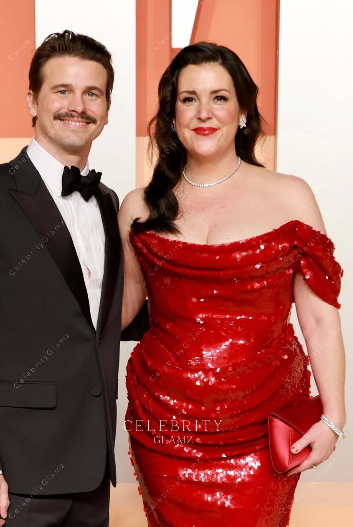 red Melanie Lynskey 2025 Vanity fair party drop sleeve dress