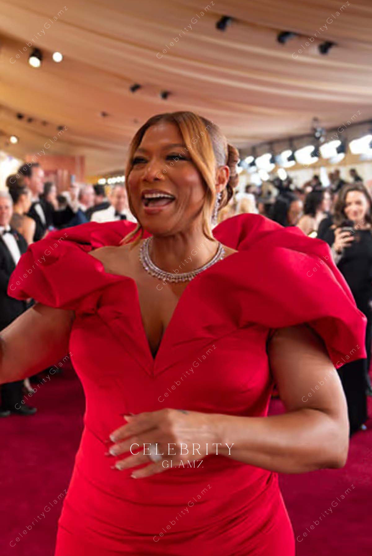 red satin Queen Latifah 2025 Oscars red carpet dress