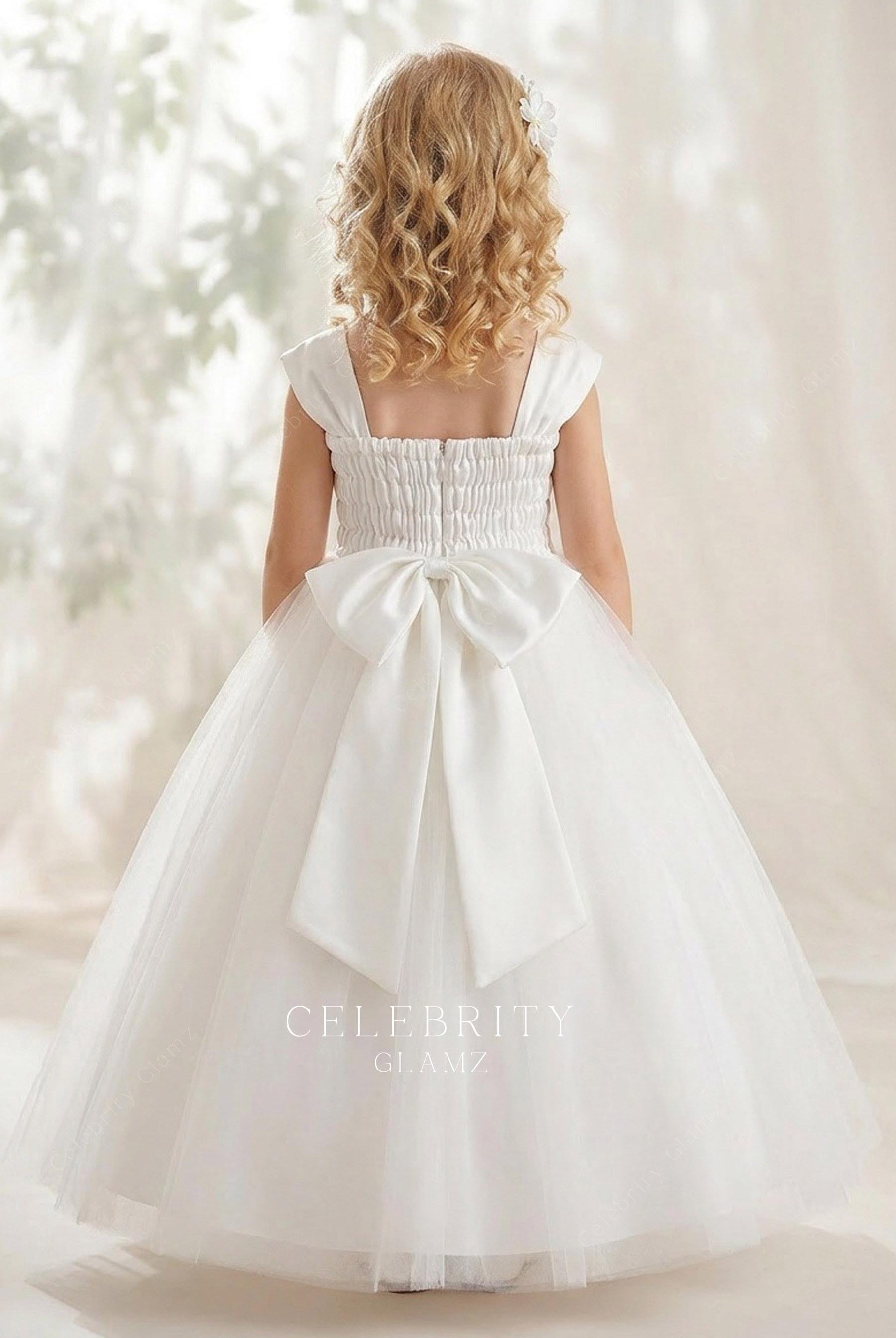 white floor length flower girl ballgown