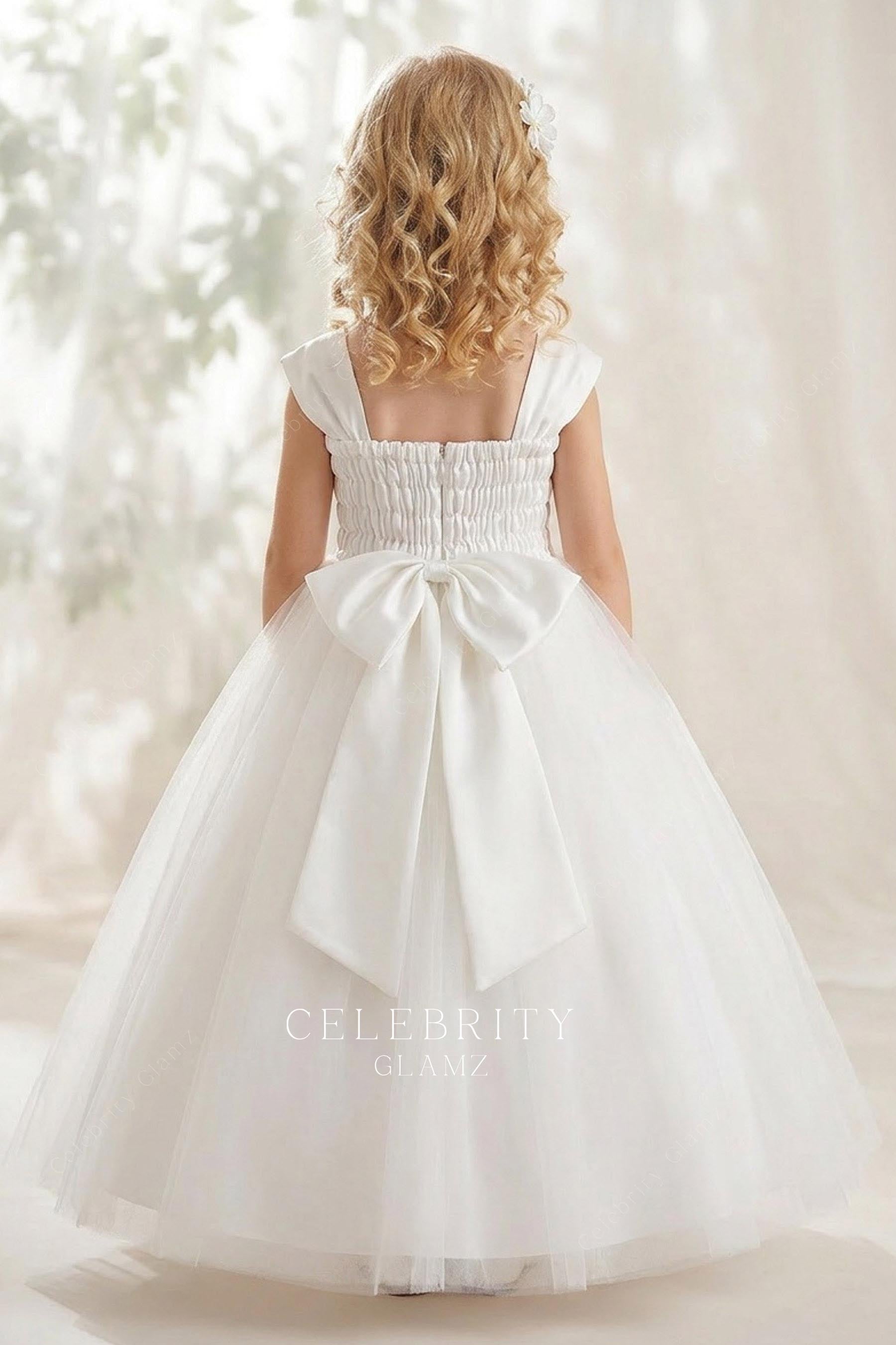white floor length flower girl ballgown
