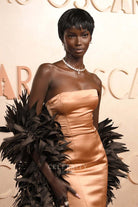 2025 Oscars red carpet Anok Yai gold satin dress 