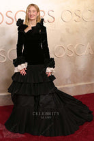 Alba Rohrwacher black ruffled neckline 2025 Oscars red carpet dress