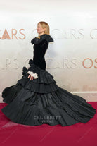 Alba Rohrwacher ruffled cuffs 2025 Oscars red carpet prom dress