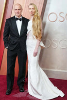 Anna Shevchuk white 2025 court train Oscars red carpet dress