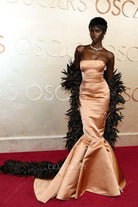 Anok Yai gold strapless 2025 Oscars red carpet dress 