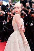 Anya Taylor shimmery sleeveless prom gown Cannes film festival red carpet 2024