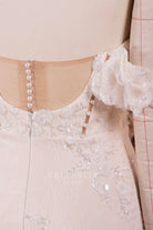 buttoned illusion back bridal dress