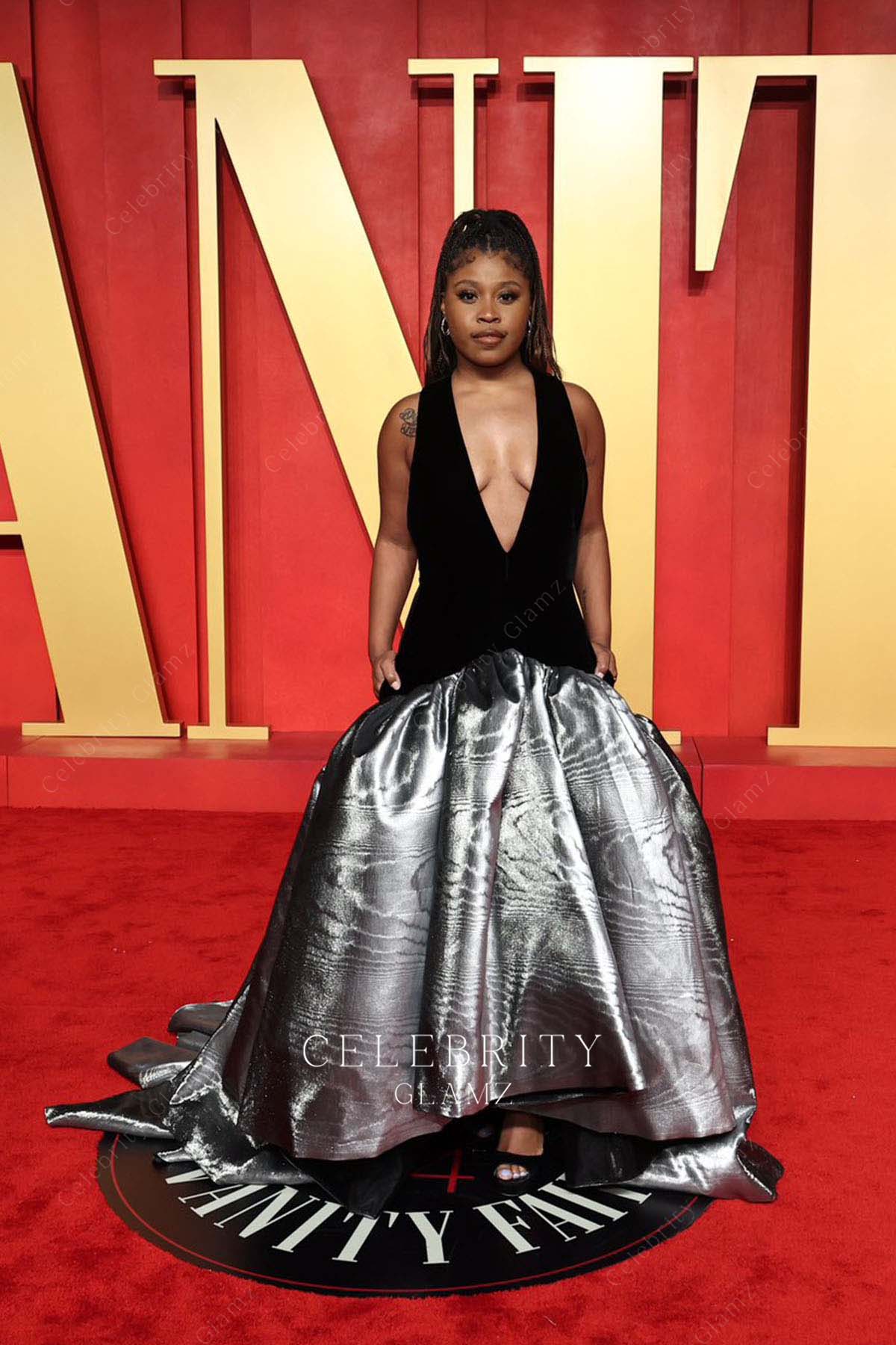 Dominique Fishback plunging neck prom dress 2024 Oscars after party 