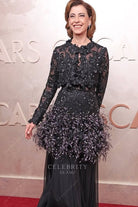 Fernanda Torres feather peplum 2025 Oscars red carpet dress