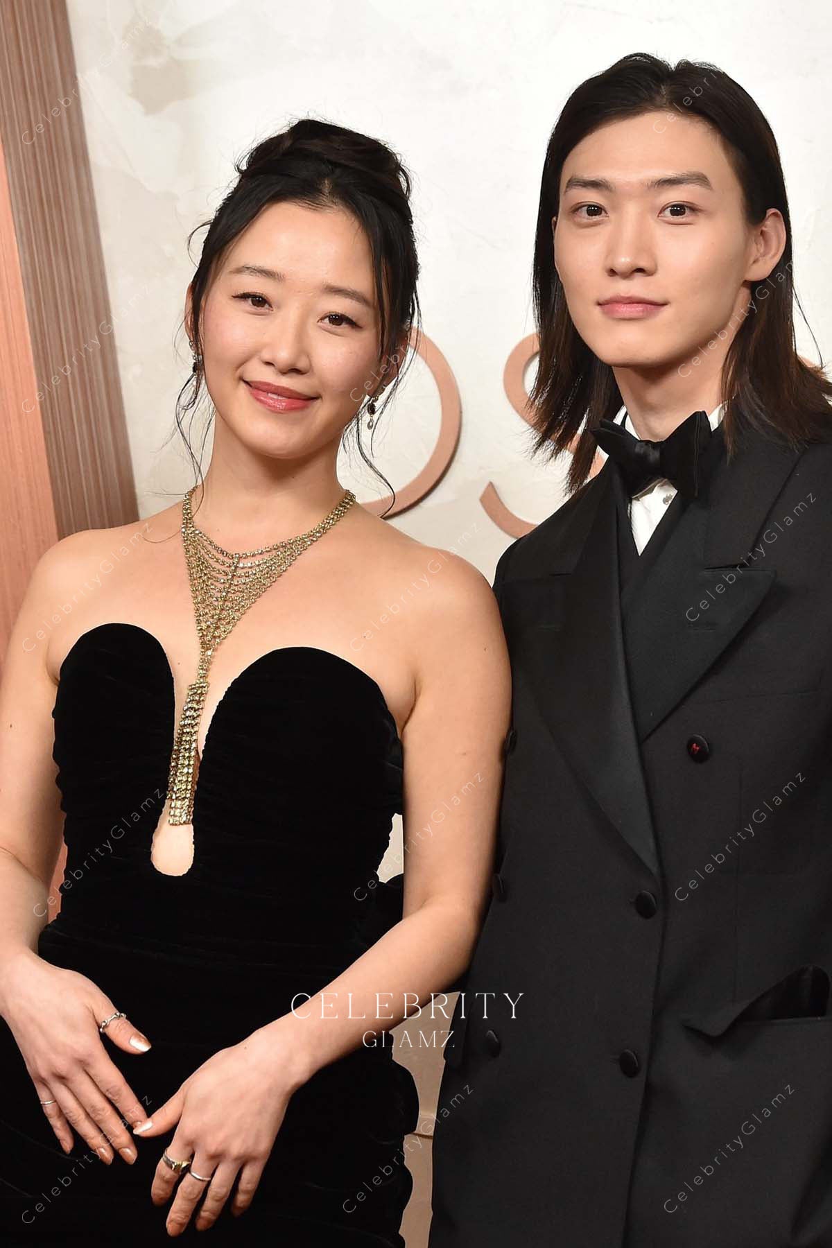 Gia Kim 2025 Oscars red carpet plunging neck dress