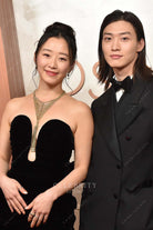 Gia Kim 2025 Oscars red carpet plunging neck dress