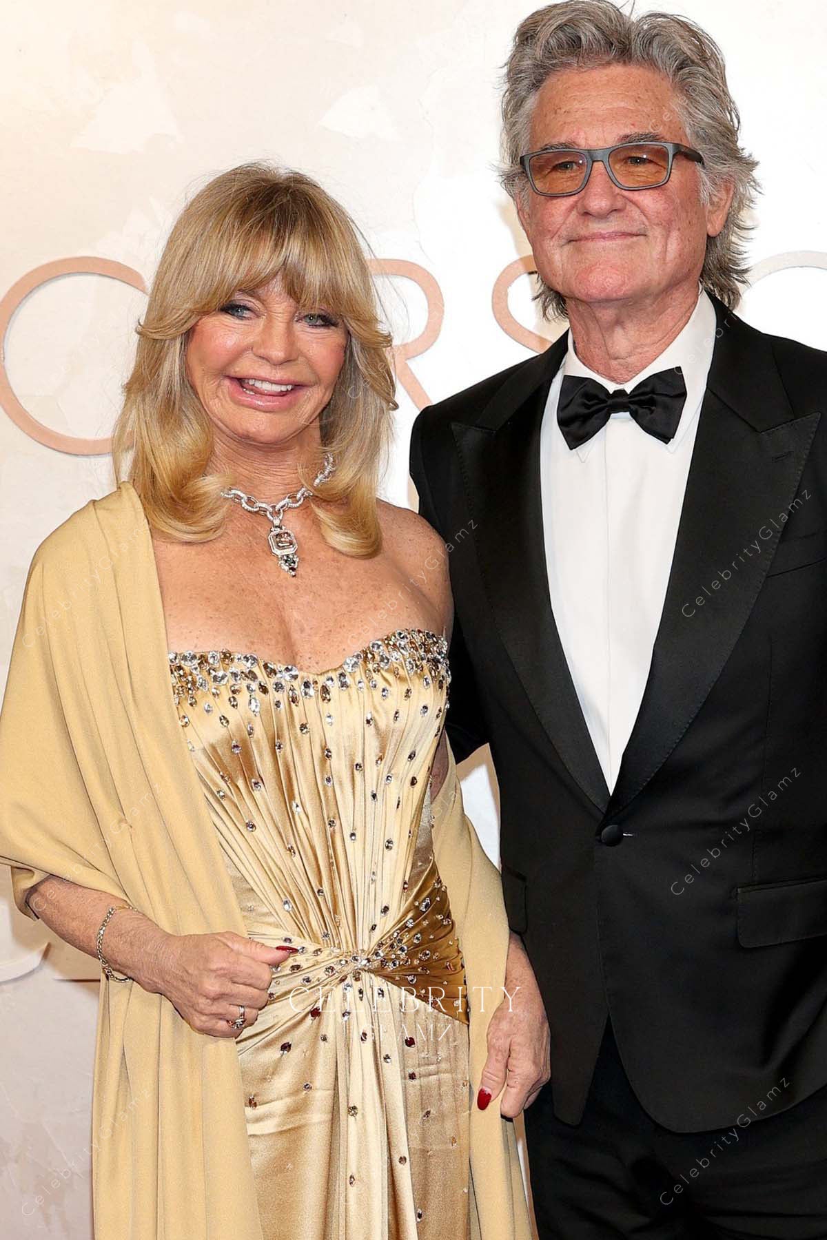 Goldie Hawn 2025 Oscars red carpet twist waist prom dress