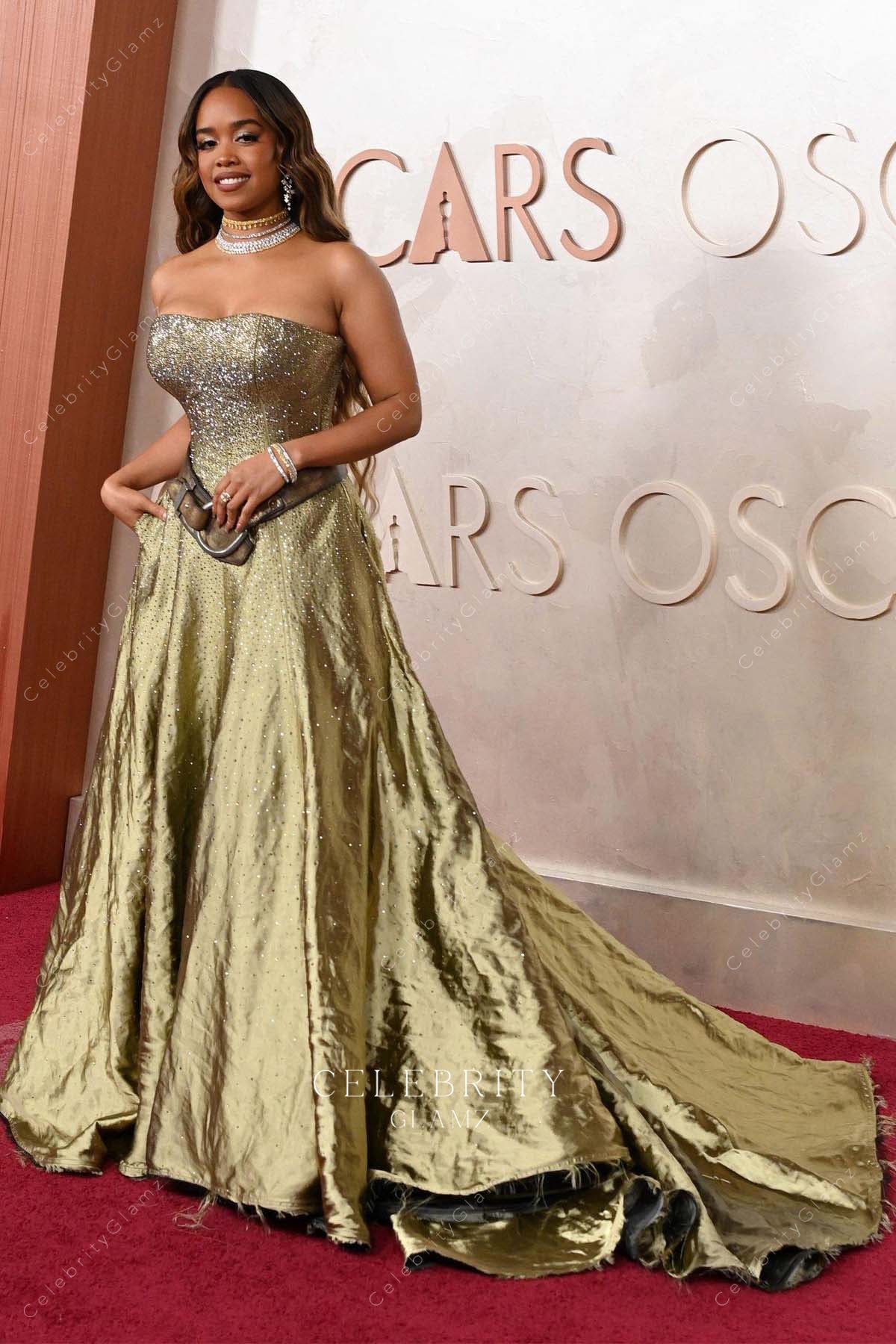 H.E.R. 2025 Oscars red carpet flowing train prom dress