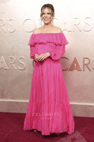 hot pink Rita Wilson off shoulder 2025 Oscars red carpet dress 