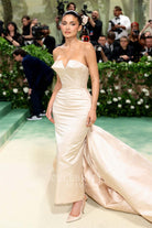 Kylie Jenner v cut neck dress met gala red carpet 2024