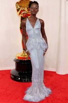 Lupita Nyong'o feathered prom dress 2024 Oscars red carpet
