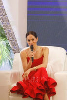 Meghan Markle red spaghetti straps flouncing prom dress women in leadership event 2024