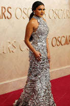 Mindy Kaling silver halter 2025 Oscars red carpet mermaid dress
