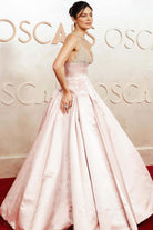 Monica Barbaro pink pleated 2025 Oscars red carpet dress