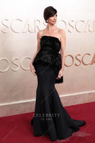Paz Vega black 2025 Oscars red carpet trumpet dress