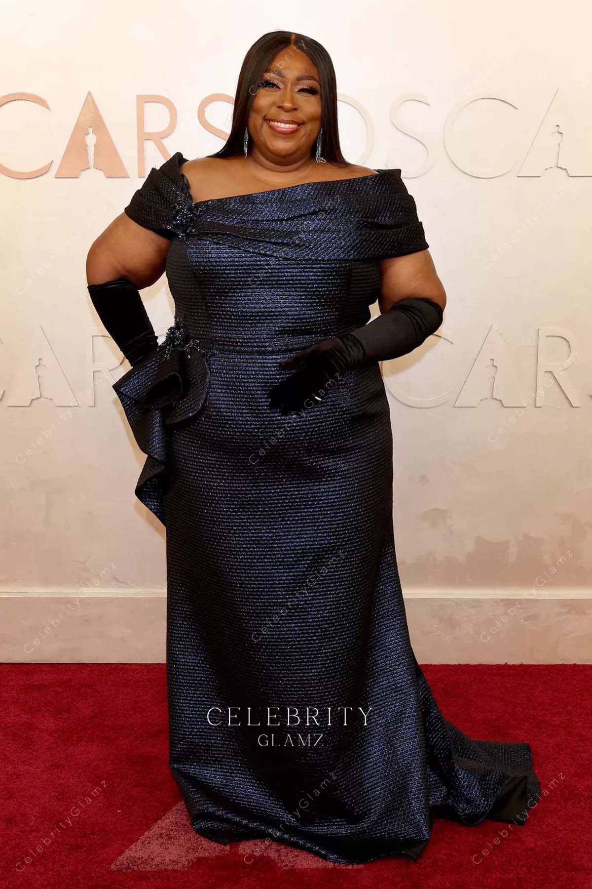 plus size Loni Love 2025 fit flare Oscars red carpet dress