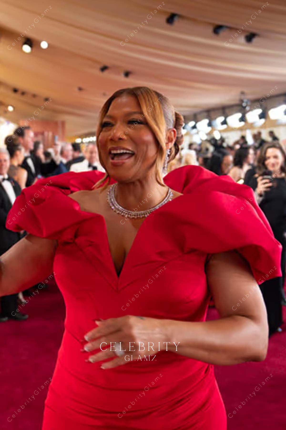 red satin Queen Latifah 2025 Oscars red carpet dress