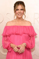 Rita Wilson 2025 Oscars red carpet ruffled neckline dress 