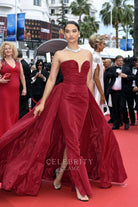 Shanina Shaik burgundy overskirt formal gown Cannes film festival red carpet 2024