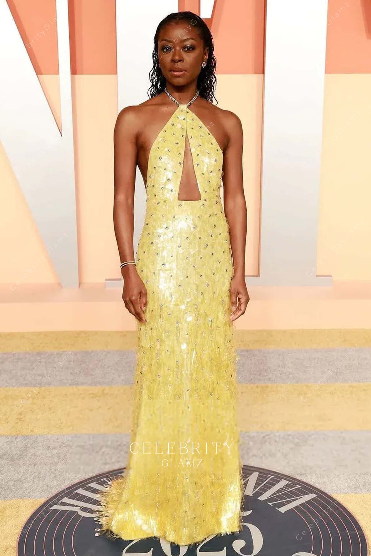 sparkly Danielle Deadwyler bright gold 2025 Vanity fair party dress