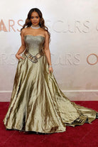 sparkly sequin H.E.R. 2025 Oscars red carpet strapless prom dress