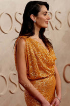 Vic Carmen Sonne gold cowl neck 2025 Oscars red carpet dress