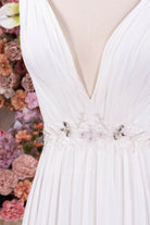 white chiffon plunging neck bridal dress
