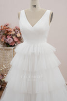 white sleeveless v neck wedding dress