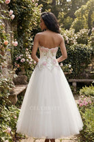 white strapless open back tulle wedding dress